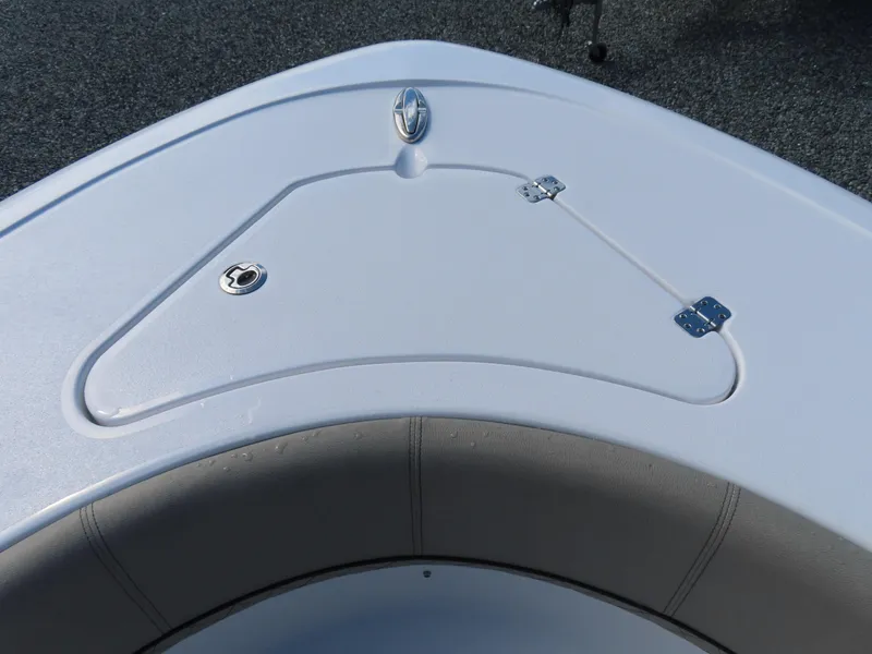 Slide: The Image of 2023 Sportsman Heritage 231 Center Console boat bow with storage compartment. - 14