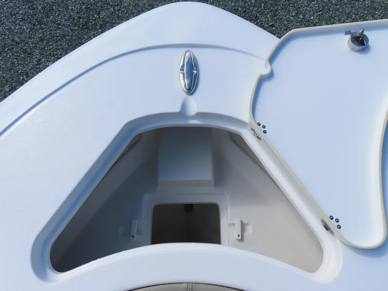 Slide: The Image of 2023 Sportsman Heritage 231 Center Console boat storage compartment, open lid, white finish. - 15