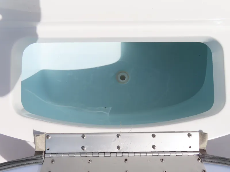 Slide: The Image of 2023 Sportsman Heritage 231 Center Console livewell with open lid. - 17