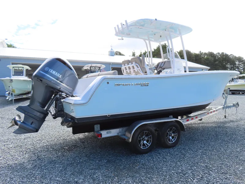 Slide: The Image of 2023 Sportsman Heritage 231 Center Console boat on trailer with Yamaha outboard motor. - 2