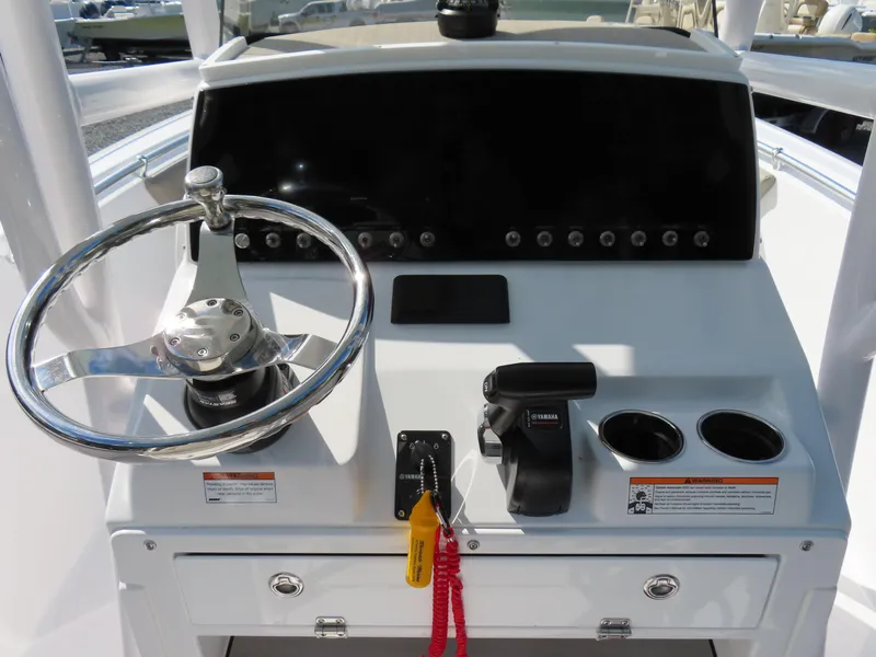 Slide: The Image of 2023 Sportsman Heritage 231 Center Console dashboard with steering wheel and controls. - 23