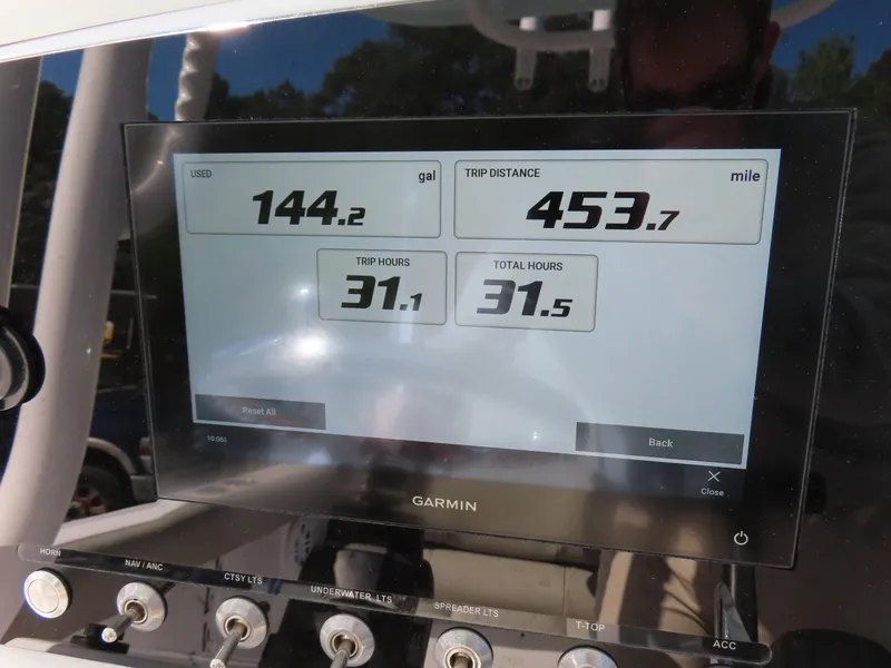 Slide: The Image of Garmin display on 2023 Sportsman Heritage 231 Center Console showing fuel and trip data. - 25