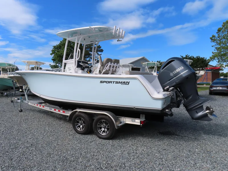 Slide: The Image of 2023 Sportsman Heritage 231 Center Console boat on trailer, featuring Yamaha outboard motor. - 3