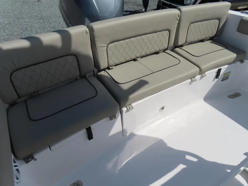 Slide: The Image of 2023 Sportsman Heritage 231 Center Console boat seating with cushioned backrests. - 32