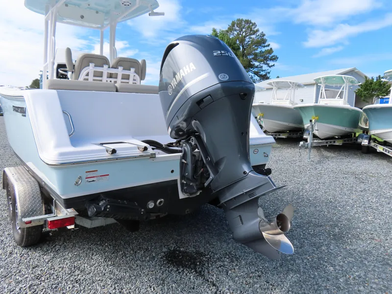 Slide: The Image of 2023 Sportsman Heritage 231 Center Console boat with Yamaha outboard motor on trailer. - 4