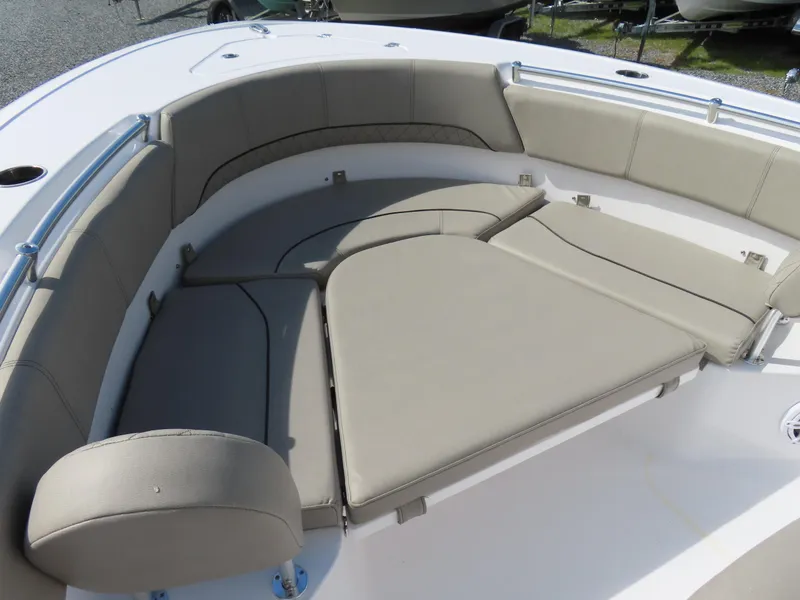 Slide: The Image of 2023 Sportsman Heritage 231 Center Console boat with cushioned seating area. - 7