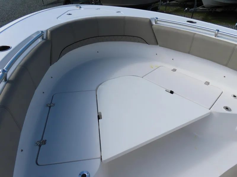 Slide: The Image of 2023 Sportsman Heritage 231 Center Console boat with spacious seating and storage compartments. - 8