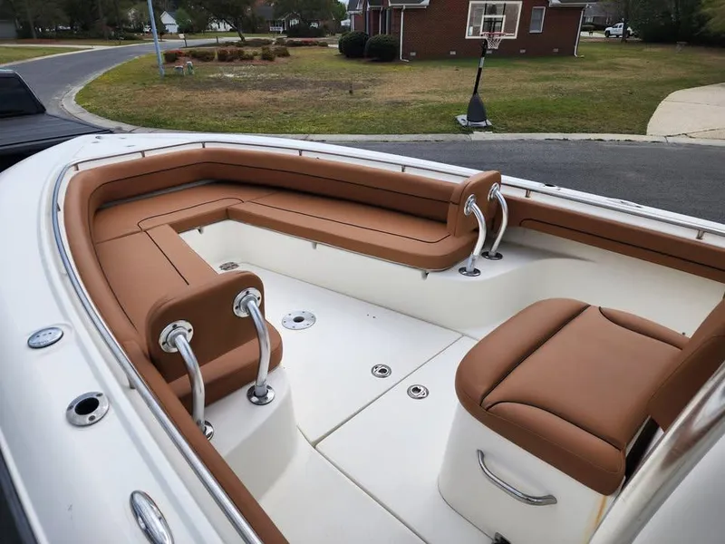 Slide: The Image of 2010 Blackwood 270 boat interior with tan seating and stainless steel accents. - 15