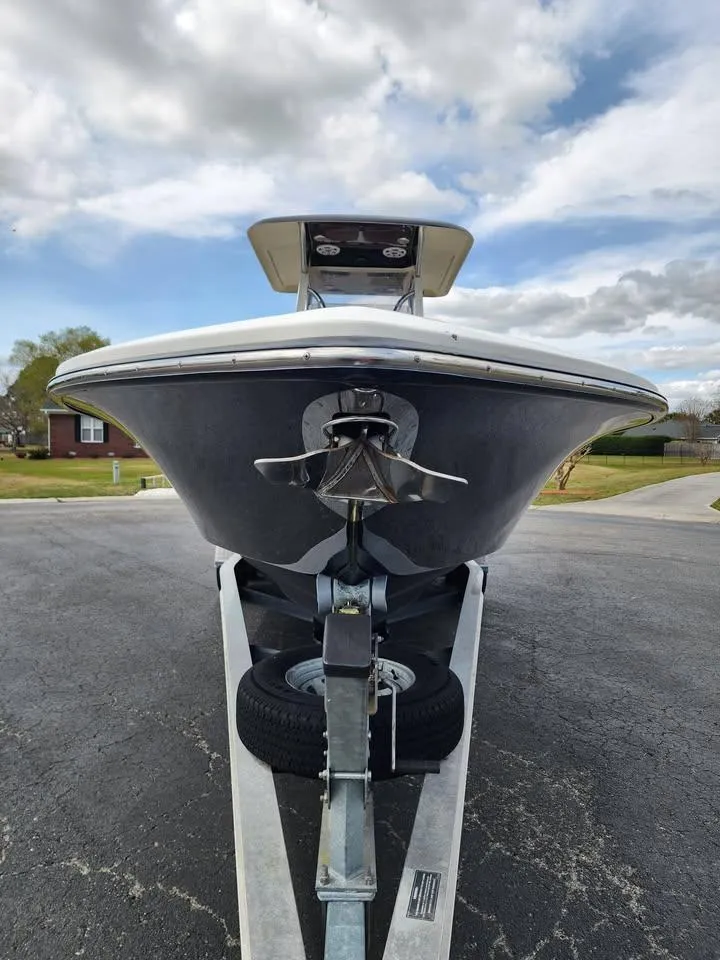 Slide: The Image of 2010 Blackwood 270 boat on trailer, front view, under cloudy sky. - 3