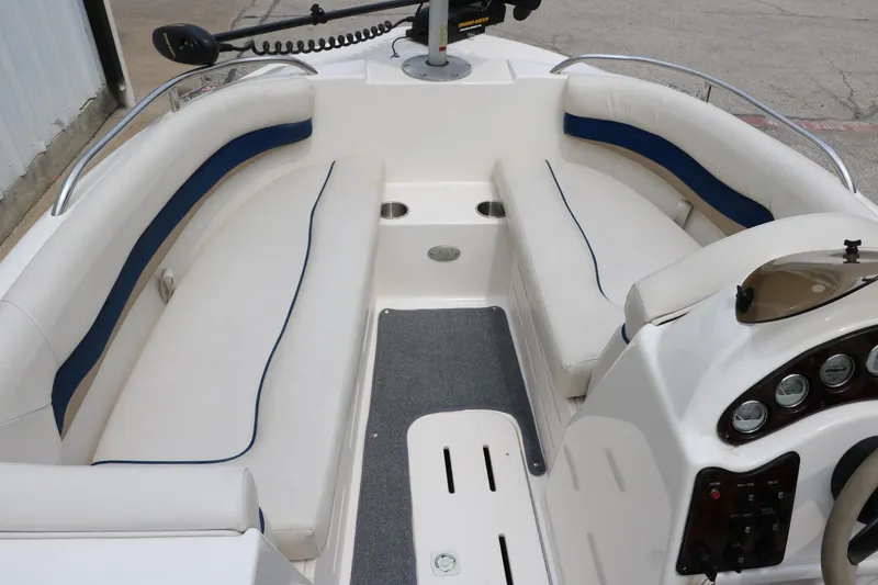 Slide: The Image of 2006 Hurricane GS 172 boat interior with white seating and control panel. - 15