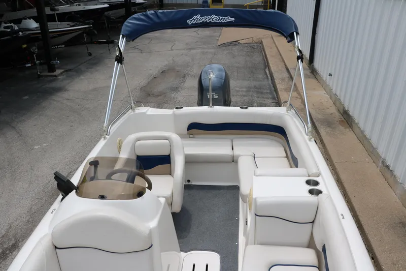 Slide: The Image of 2006 Hurricane GS 172 boat interior with seating and steering wheel. - 18