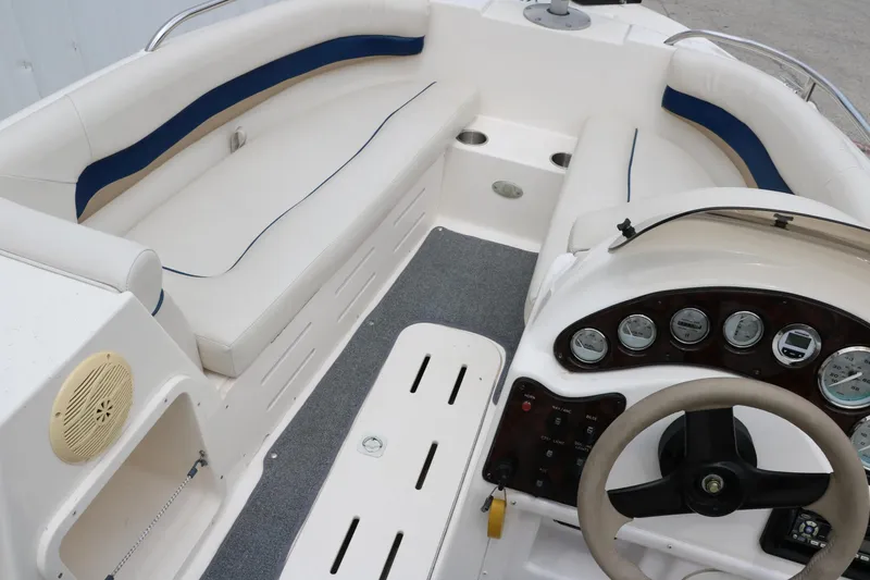 Slide: The Image of 2006 Hurricane GS 172 boat interior with white seating and control panel. - 24