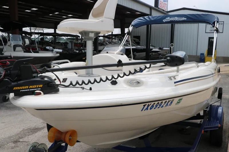 Slide: The Image of 2006 Hurricane GS 172 boat with trolling motor and canopy in a storage facility. - 6