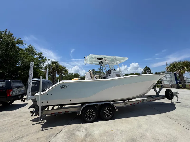Slide: The Image of 2022 Sea Fox 288 Commander boat on trailer under clear blue sky. - 13