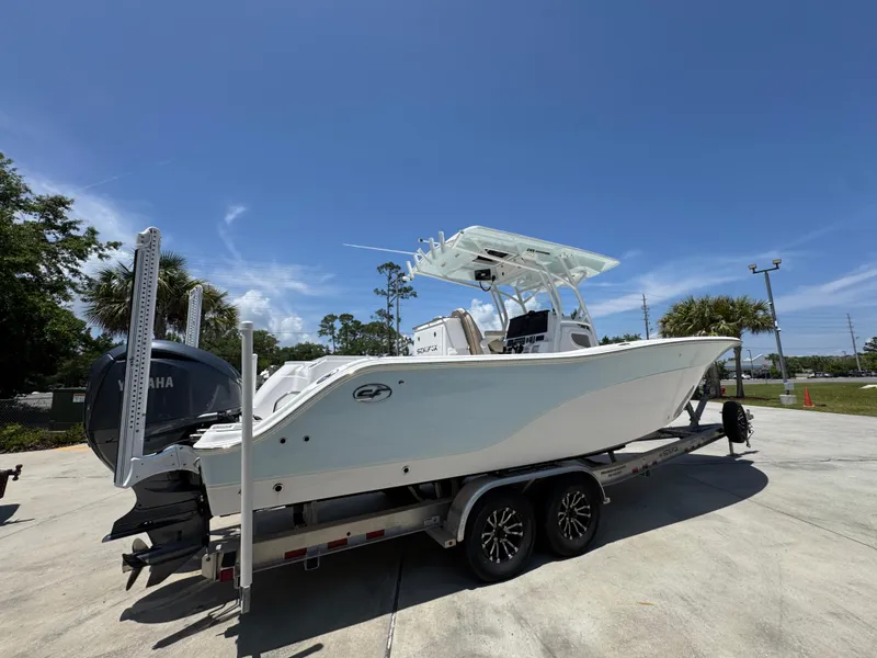 Slide: The Image of 2022 Sea Fox 288 Commander boat on trailer under clear blue sky. - 14