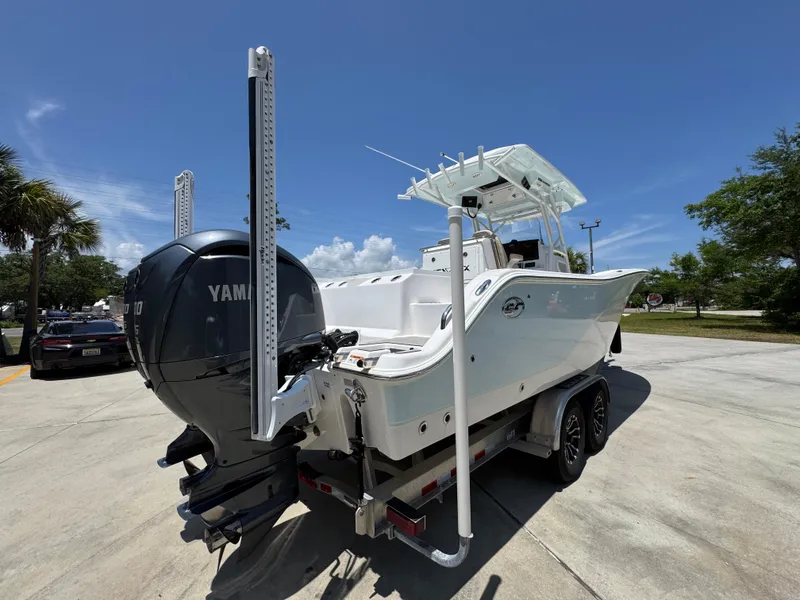 Slide: The Image of 2022 Sea Fox 288 Commander boat with Yamaha engine on trailer, parked outdoors. - 15