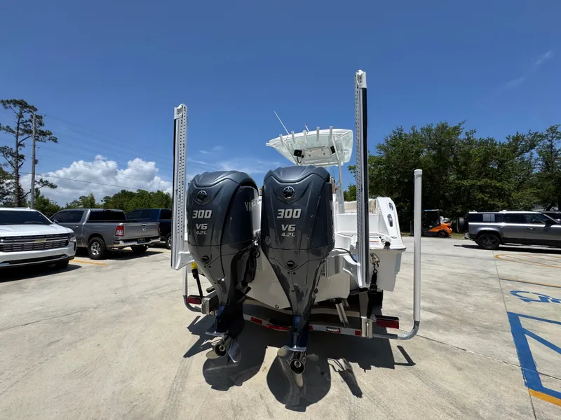 Slide: The Image of 2022 Sea Fox 288 Commander boat with dual 300 V6 engines in a parking lot. - 17