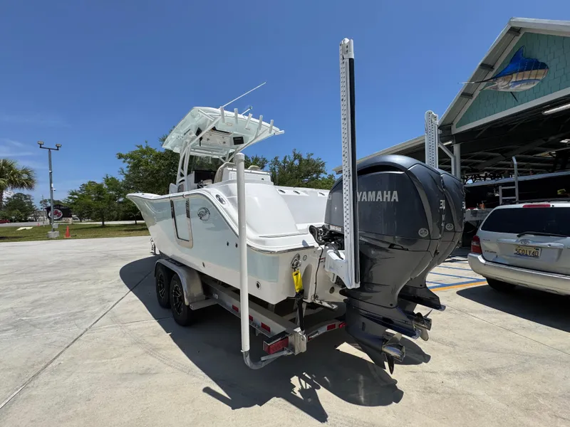 Slide: The Image of 2022 Sea Fox 288 Commander boat with Yamaha engine on trailer, parked outdoors. - 20