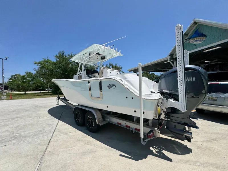 Slide: The Image of 2022 Sea Fox 288 Commander boat on trailer with Yamaha outboard motor, parked outdoors. - 21