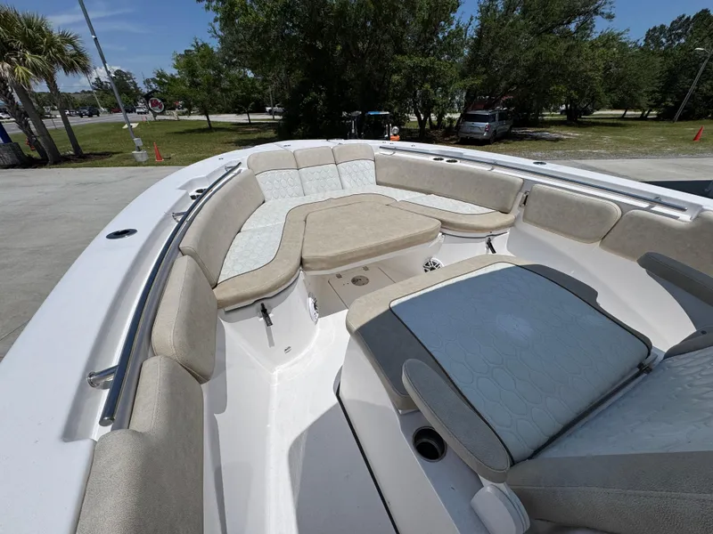Slide: The Image of 2022 Sea Fox 288 Commander boat interior with cushioned seating and spacious layout. - 23