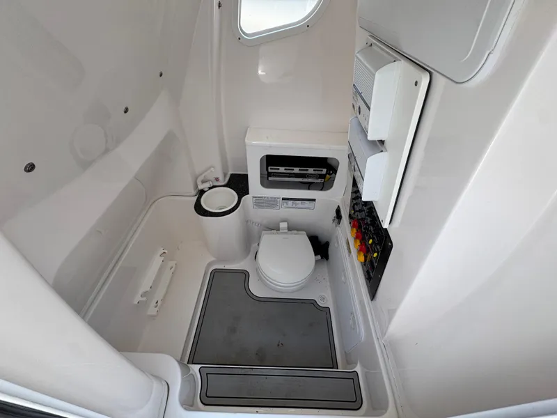 Slide: The Image of 2022 Sea Fox 288 Commander boat interior with toilet and control panel. - 31