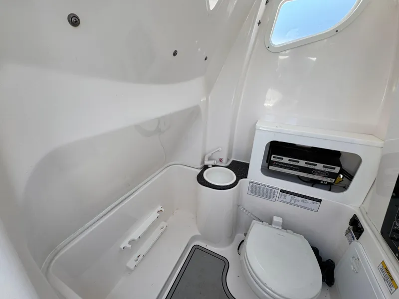 Slide: The Image of 2022 Sea Fox 288 Commander boat interior with toilet and storage compartment. - 34