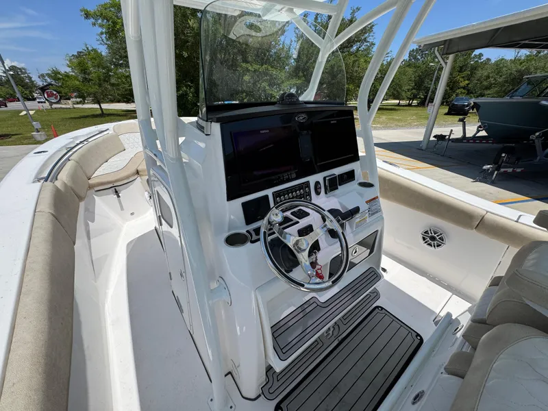 Slide: The Image of 2022 Sea Fox 288 Commander boat cockpit with steering wheel and control panel. - 37