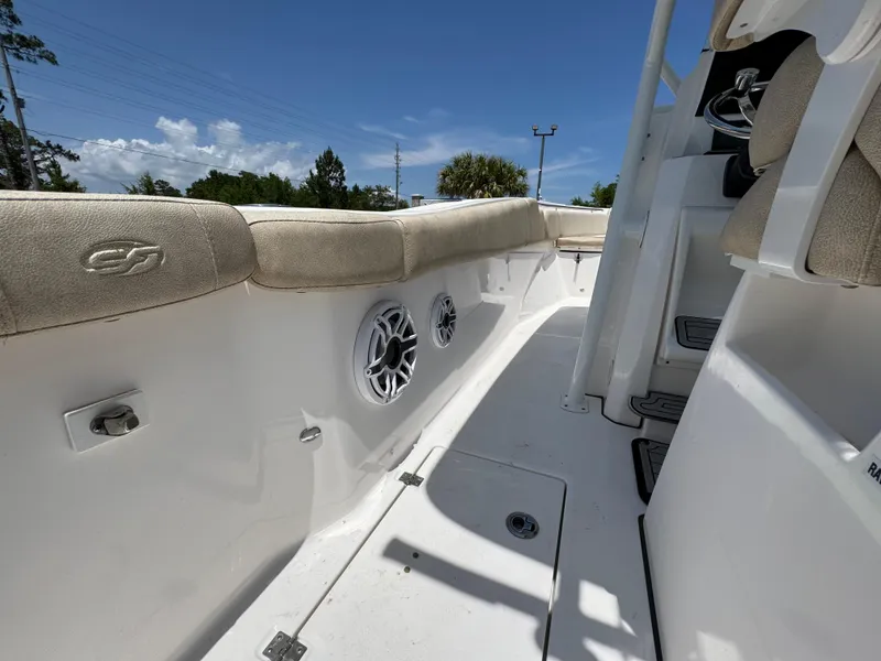 Slide: The Image of 2022 Sea Fox 288 Commander boat interior with cushioned seating and built-in speakers. - 43
