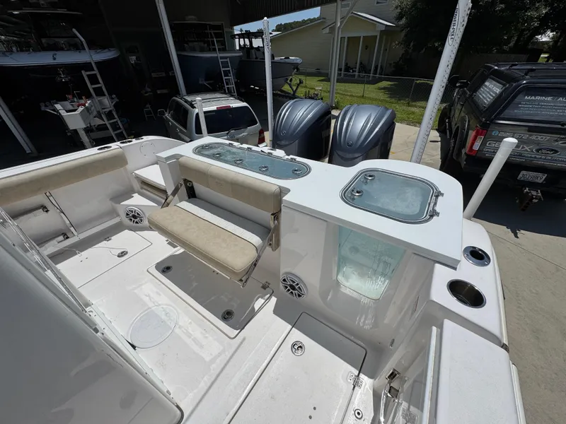 Slide: The Image of 2022 Sea Fox 288 Commander boat deck with seating and storage compartments. - 49