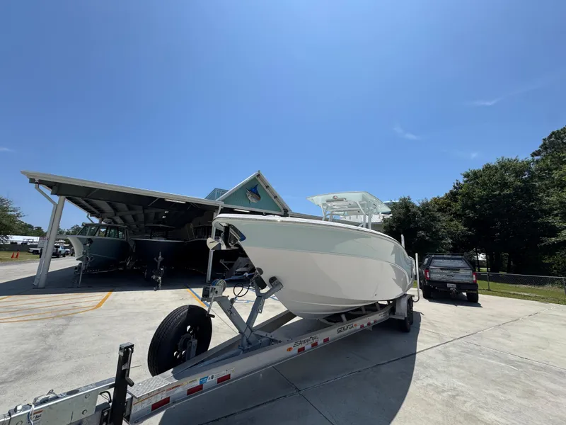 Slide: The Image of 2022 Sea Fox 288 Commander boat on trailer under clear blue sky. - 5