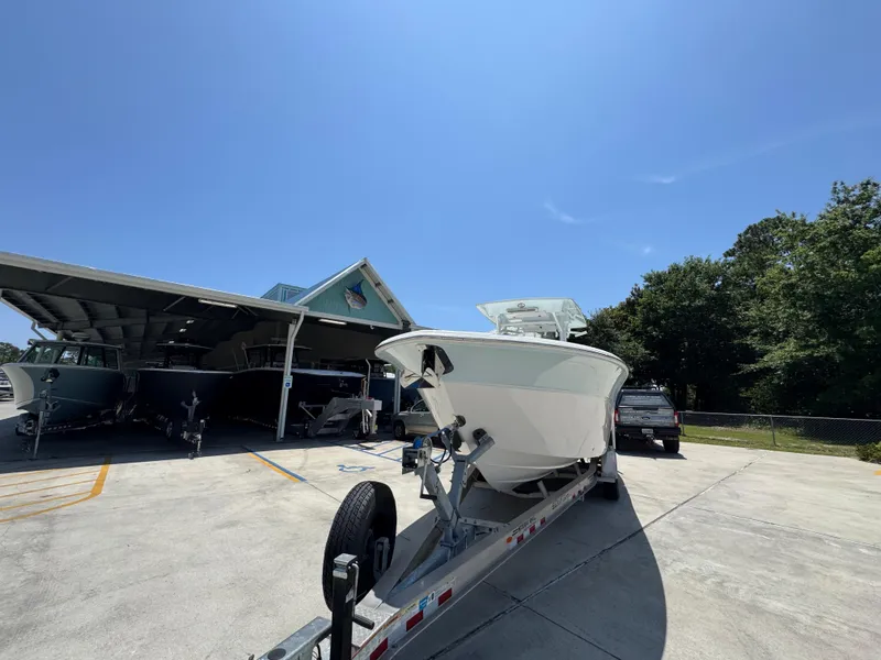 Slide: The Image of 2022 Sea Fox 288 Commander boat on trailer under clear blue sky. - 6