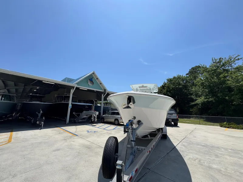 Slide: The Image of 2022 Sea Fox 288 Commander boat on trailer in sunny outdoor setting. - 7