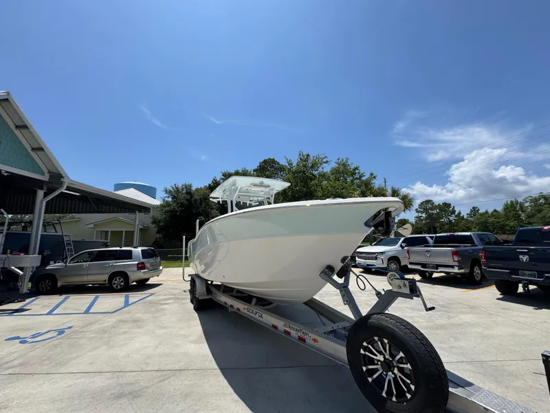 Slide: The Image of 2022 Sea Fox 288 Commander boat on trailer in parking lot under clear sky. - 9