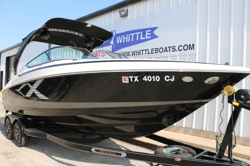 Slide: The Image of 2014 Regal 2500 RX Bowrider boat on trailer, parked outside Whittle Boats dealership. - 12