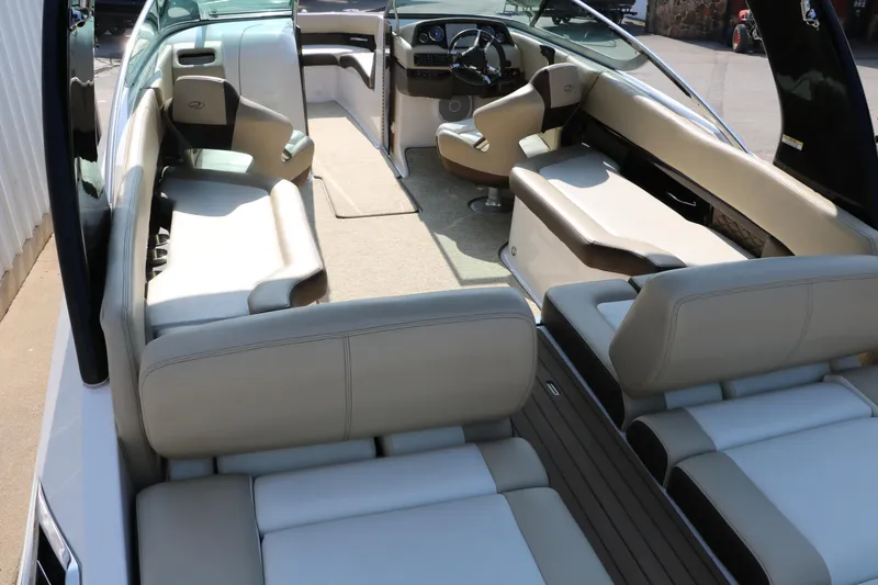 Slide: The Image of 2014 Regal 2500 RX Bowrider interior with beige seating and modern dashboard. - 16