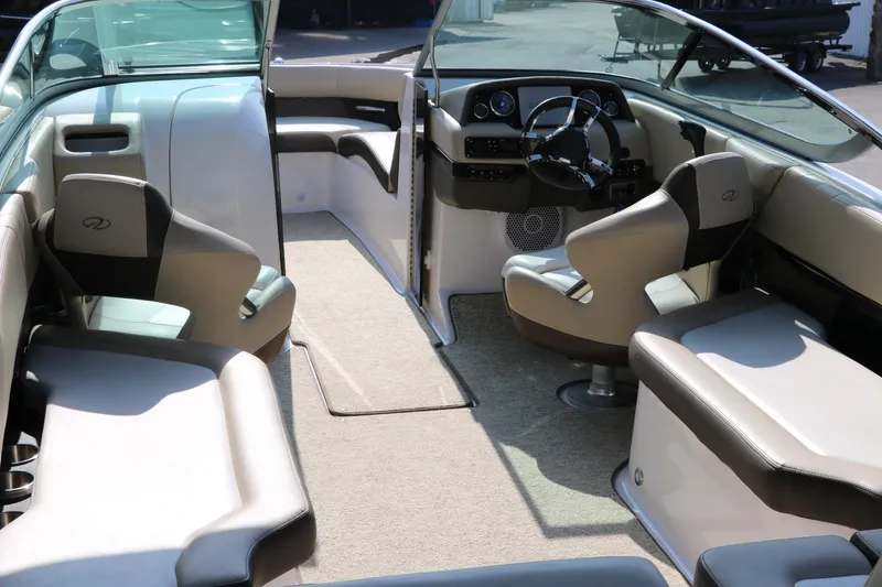 Slide: The Image of 2014 Regal 2500 RX Bowrider interior with seating and steering wheel. - 17