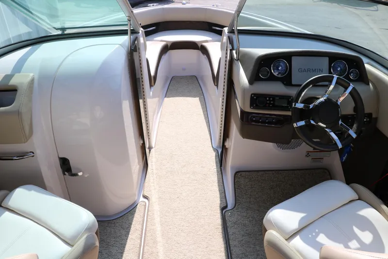 Slide: The Image of 2014 Regal 2500 RX Bowrider interior with steering wheel and Garmin display. - 20