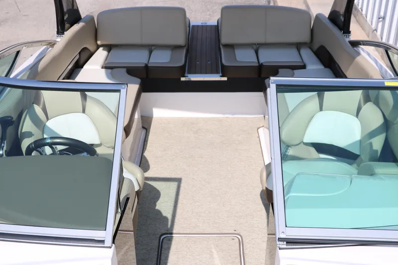 Slide: The Image of 2014 Regal 2500 RX Bowrider interior with beige seating and dual windshields. - 21