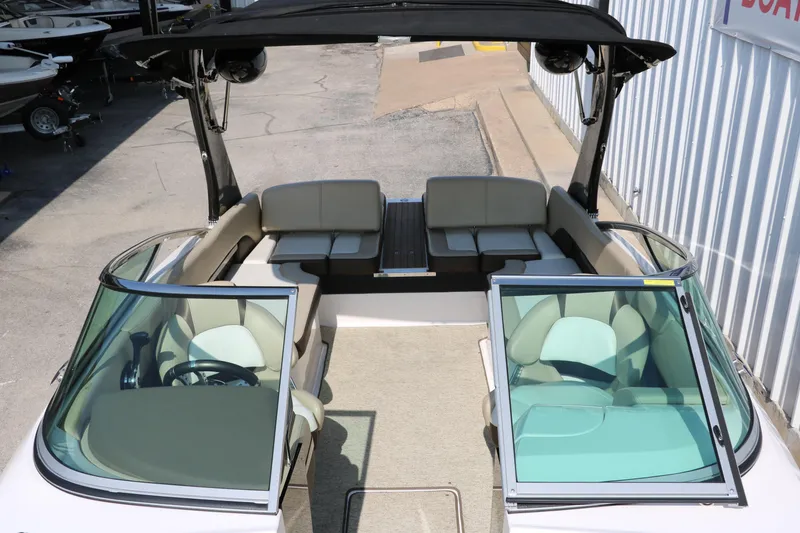 Slide: The Image of 2014 Regal 2500 RX Bowrider with open seating and sleek design. - 22