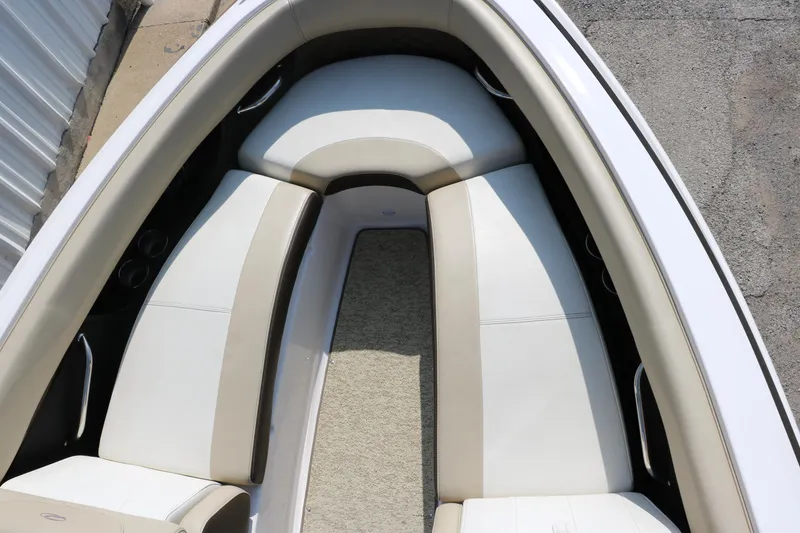 Slide: The Image of 2014 Regal 2500 RX Bowrider boat interior with white and beige seating. - 23