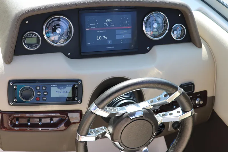 Slide: The Image of Dashboard of 2014 Regal 2500 RX Bowrider with modern gauges and steering wheel. - 28