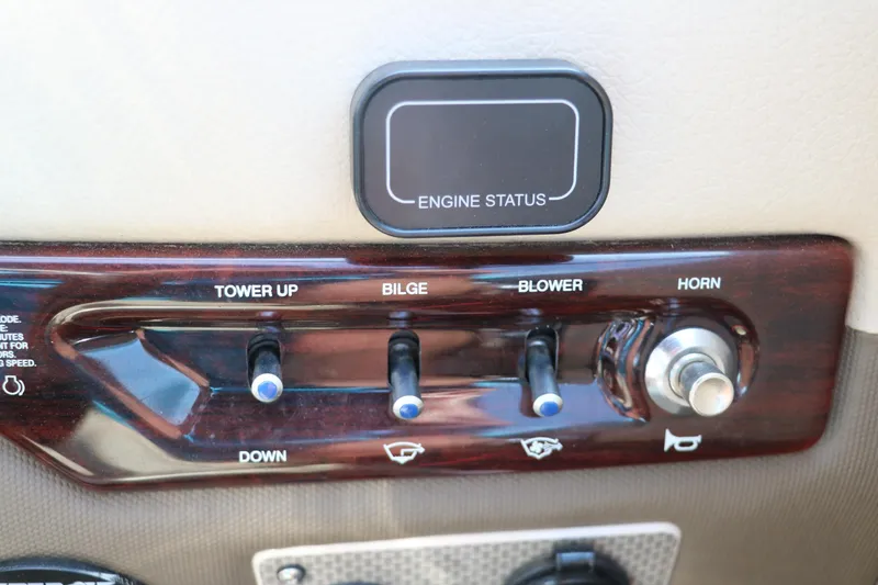Slide: The Image of Control panel of 2014 Regal 2500 RX Bowrider with switches for tower, bilge, blower, and horn. - 32