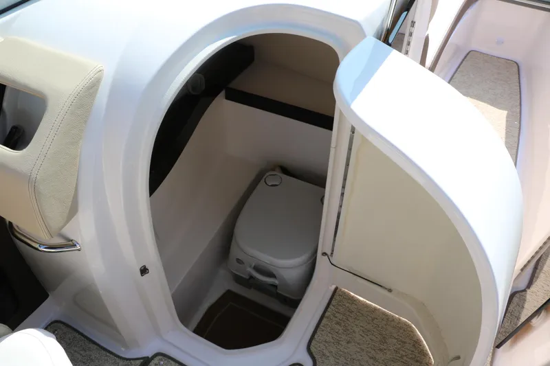Slide: The Image of 2014 Regal 2500 RX Bowrider interior with compact marine toilet. - 36