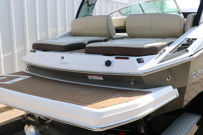 Slide: The Image of 2014 Regal 2500 RX Bowrider boat with spacious rear seating and swim platform. - 4