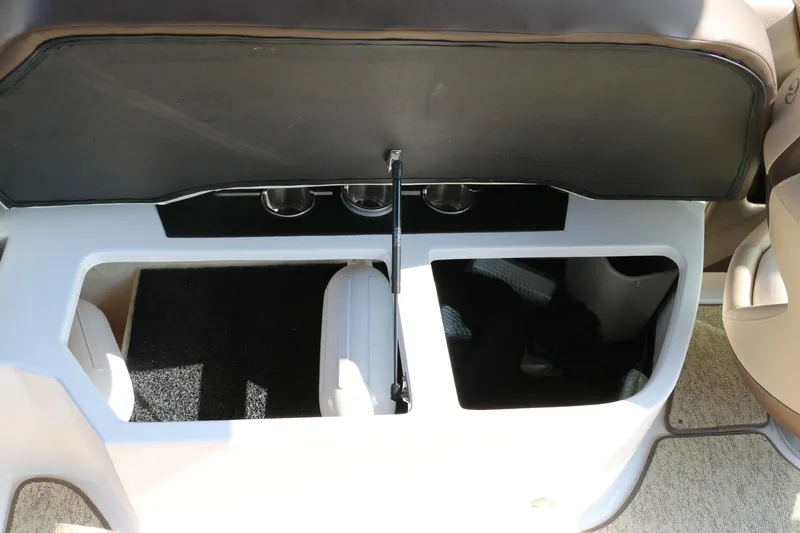 Slide: The Image of 2014 Regal 2500 RX Bowrider storage compartments with cup holders and seating. - 43