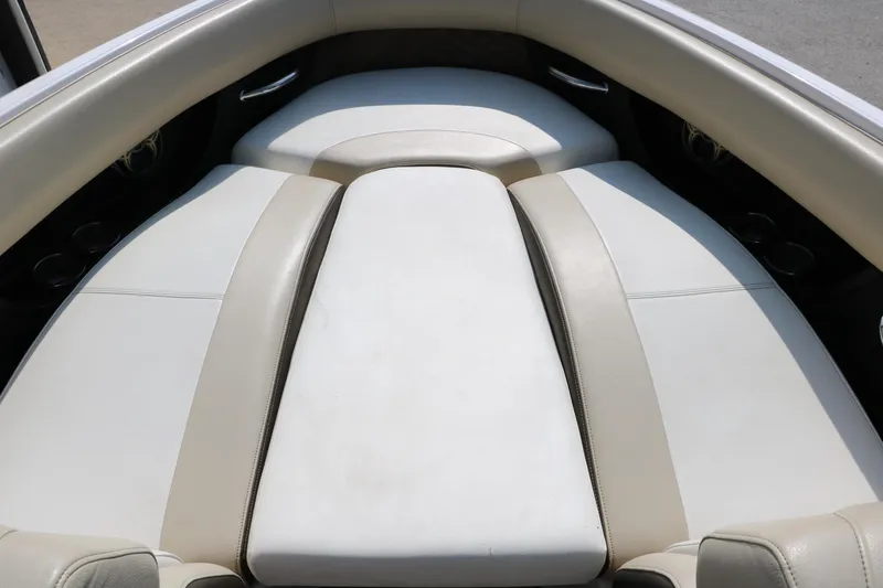 Slide: The Image of 2014 Regal 2500 RX Bowrider interior with white cushioned seating. - 44