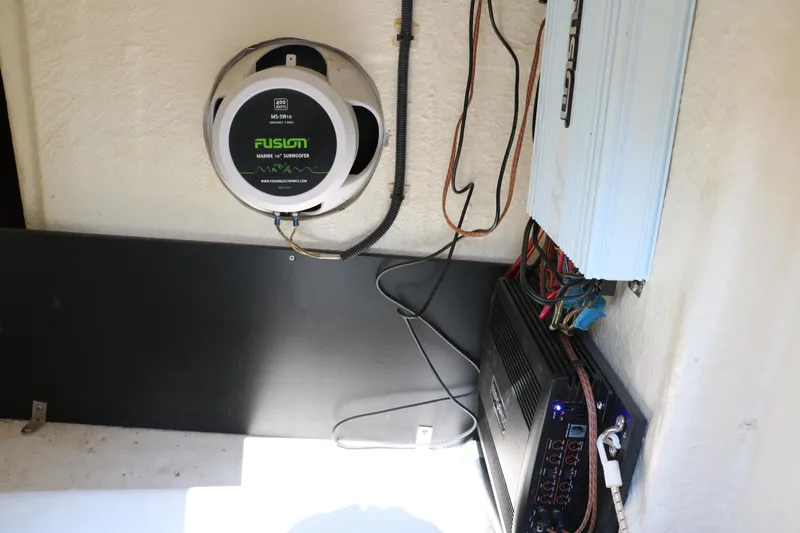 Slide: The Image of 2014 Regal 2500 RX Bowrider audio system with Fusion subwoofer and amplifier setup. - 45