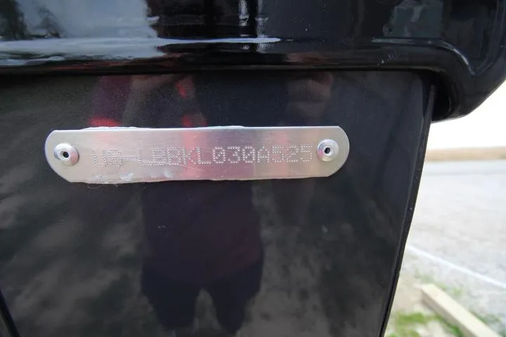 Slide: The Image of 2025 Lund 2075 Tyee boat identification plate on black surface. - 10