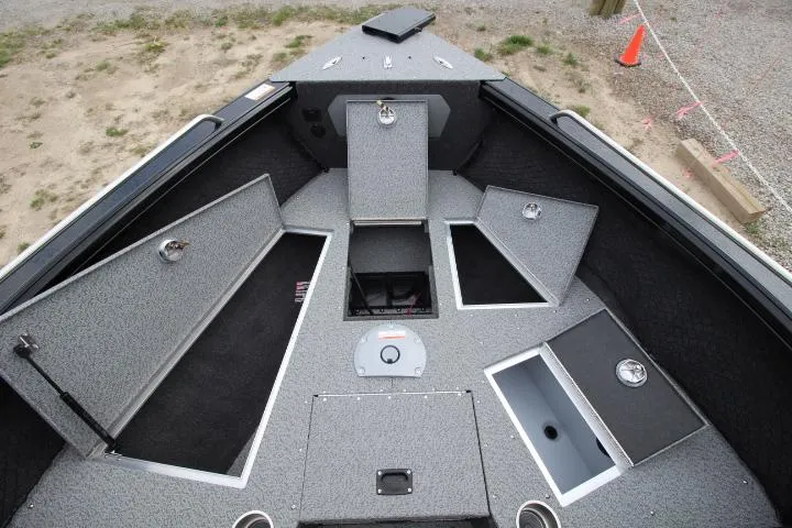 Slide: The Image of 2025 Lund 2075 Tyee boat interior with open storage compartments and sleek design. - 6