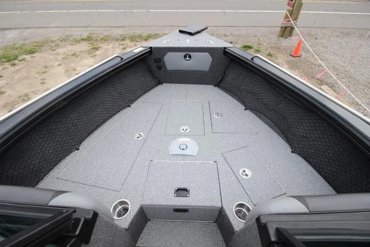 Slide: The Image of 2025 Lund 2075 Tyee boat interior with spacious deck and storage compartments. - 7